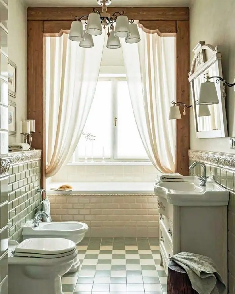 Bathroom with a tub under a window draped in sheer curtains, a crystal chandelier and a green and white checkered floor