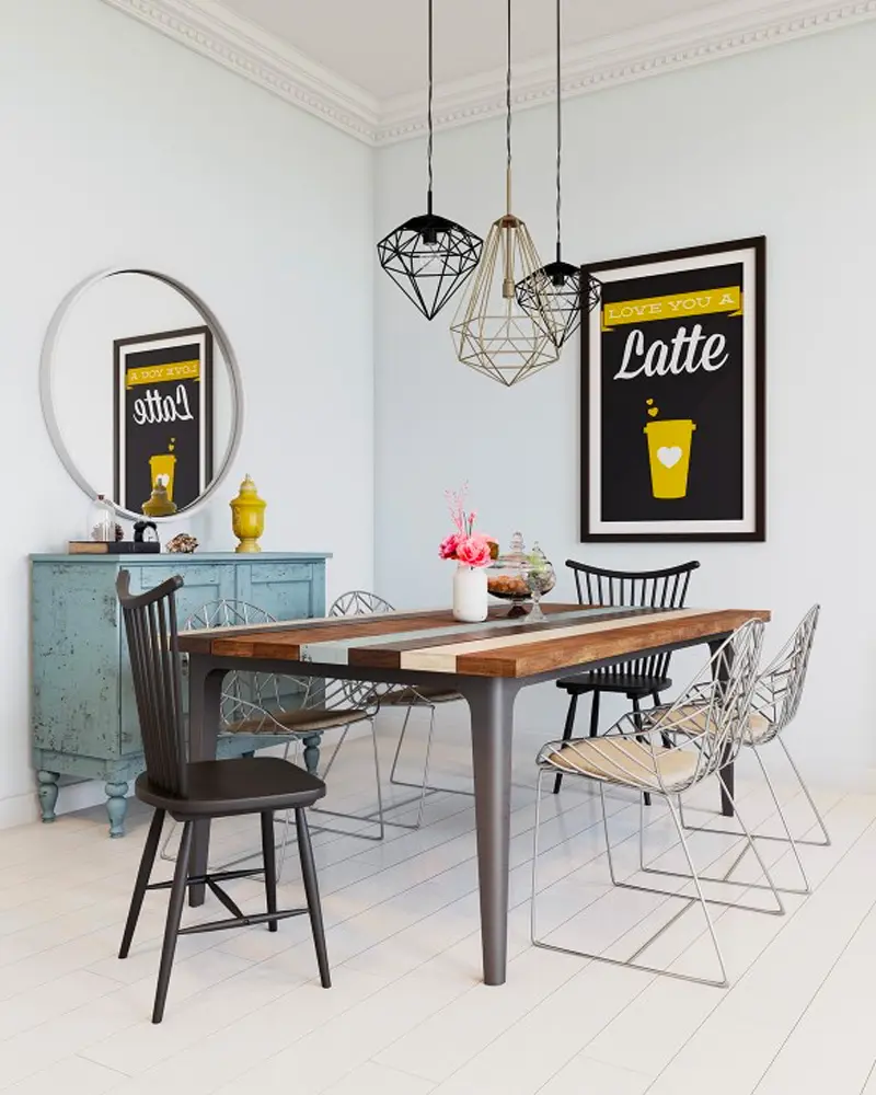 Wood plank table with black spindle and wire chairs, geometric wire pendants and Latte poster