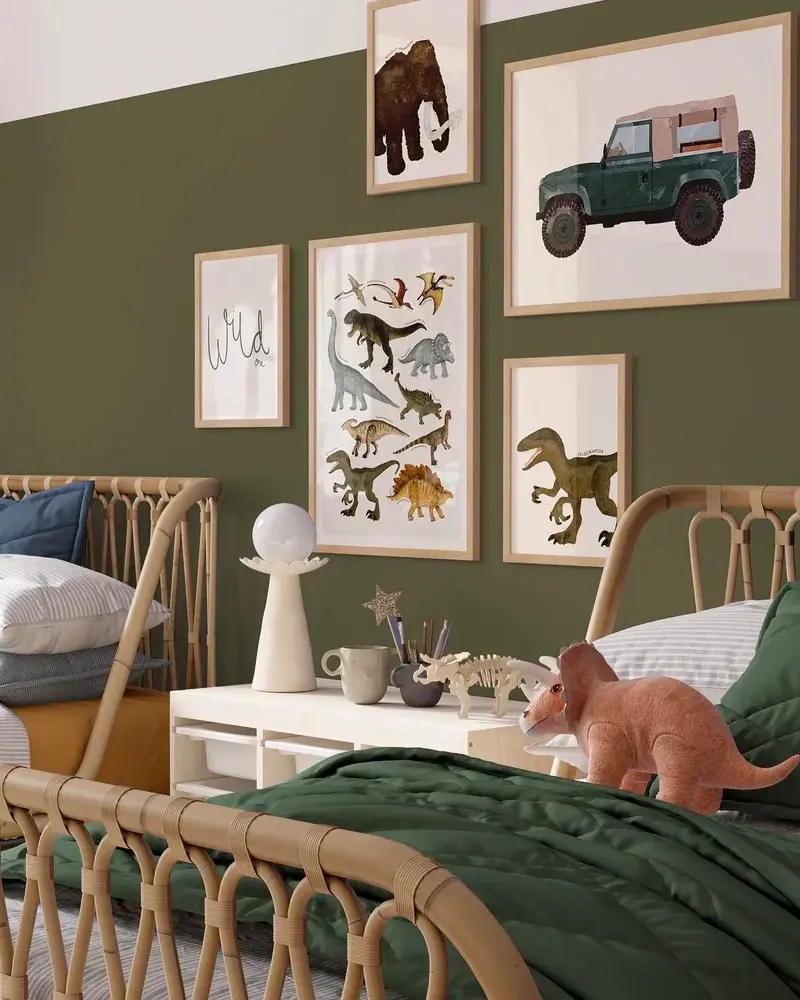 Kids room with olive green wall, rattan bed and gallery of dinosaur and jeep prints