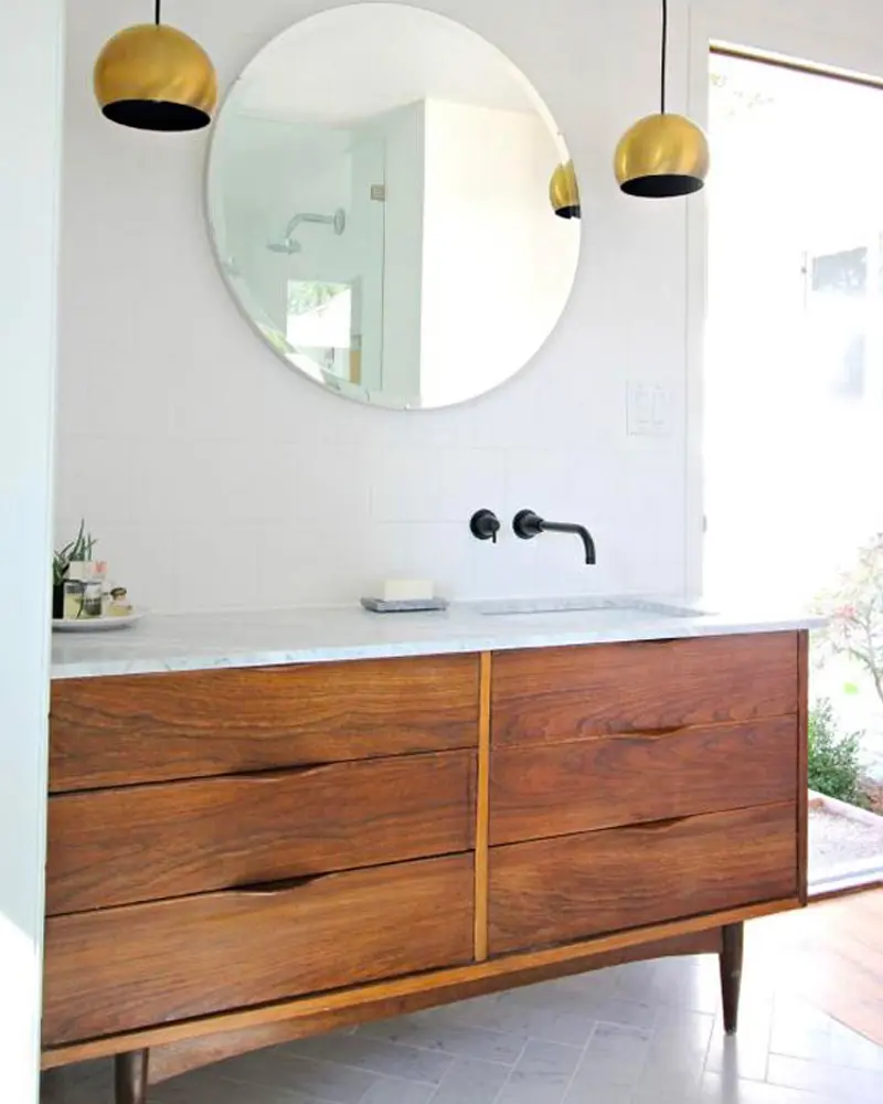 Walnut mid-century dresser vanity with marble top, round mirror and brass pendant