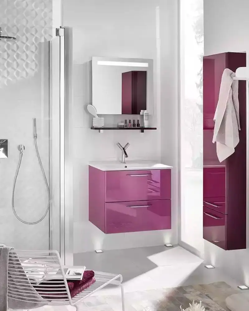 White bathroom with a glossy magenta-purple floating vanity and tall cabinet