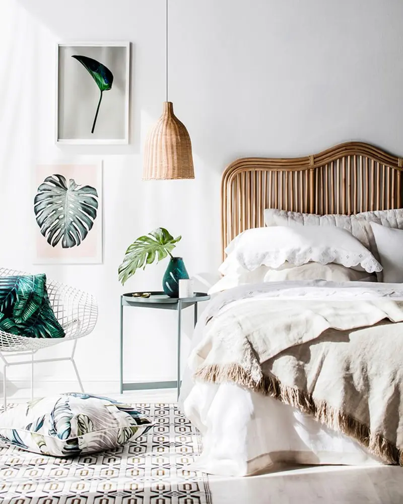 Rattan headboard, palm leaf prints and linen bedding