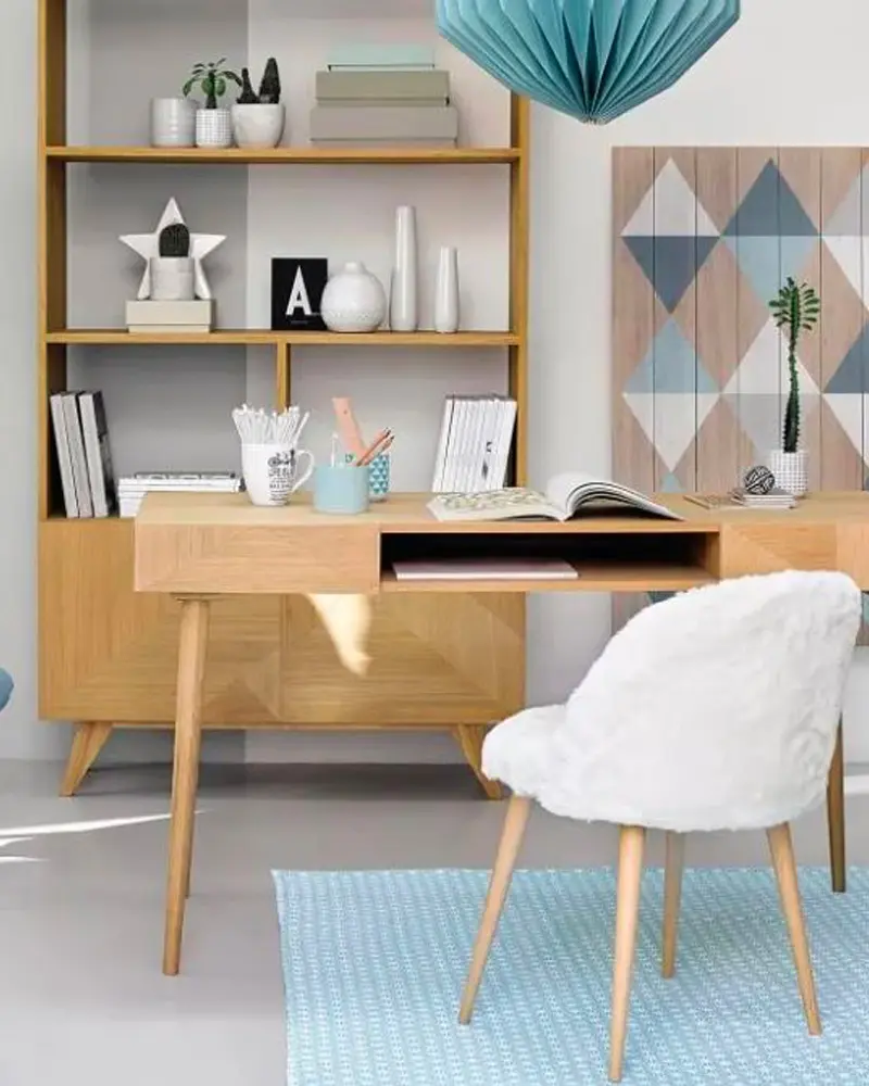 Wood desk with tapered legs, open bookcase, faux fur chair, geometric art and paper lantern
